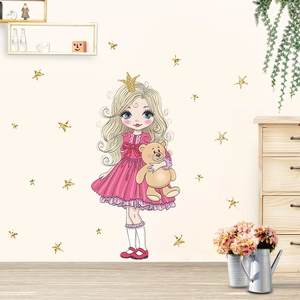 Close-up of a cartoon princess and teddy bear wall sticker in a cozy bedroom setting