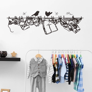 Minimalist black bird silhouettes on laundry line wall sticker for cozy room decor