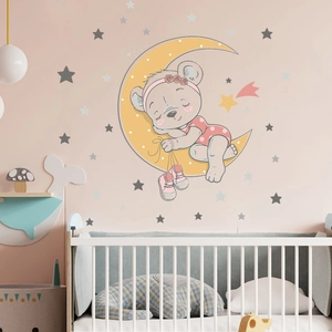 Détail de l'autocollant mural d'ours dormant sur la lune avec étoiles pour nurserie