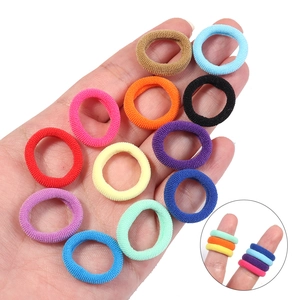 Close-up of colorful high-elasticity hair ties showing stretch and soft towel texture