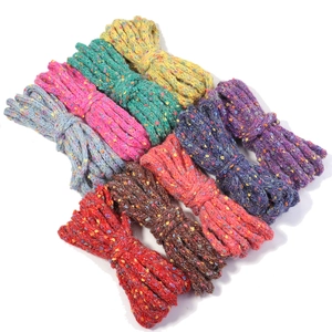 Collection of colorful tweed yarn bundles with flecked texture for DIY knitting crafts