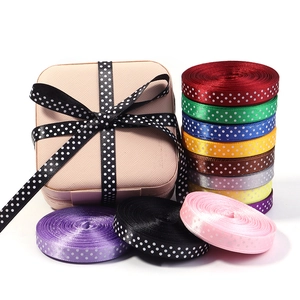 Detailed view of colorful polka dot satin ribbons for gift wrapping and DIY crafts decor