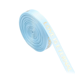Detail of light blue grosgrain ribbon with gold Love is Eternal printed text