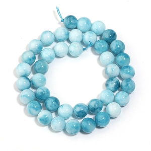 Macro shot of polished blue and white marbled sea-pattern chalcedony round beads