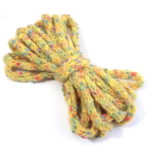 Close-up of bright yellow chunky knit yarn with multi-color speckles for DIY crafts