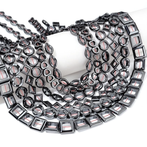 Macro detail of geometric hematite beads with metallic luster for DIY jewelry making