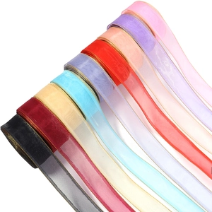 Macro view of organza ribbons with golden edges in various colors for DIY crafts