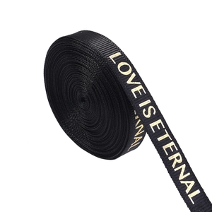 Detail of black rib ribbon with gold Love Is Eternal text for DIY gift wrapping