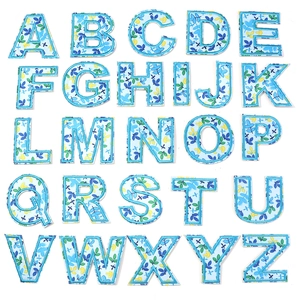 Detailed close-up showing all 26 floral alphabet embroidery patches with blue borders