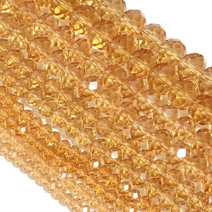 Macro view of amber faceted crystal rondelle beads for DIY jewelry making and crafts