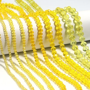 Macro view of yellow faceted crystal abacus beads for DIY handmade jewelry crafting