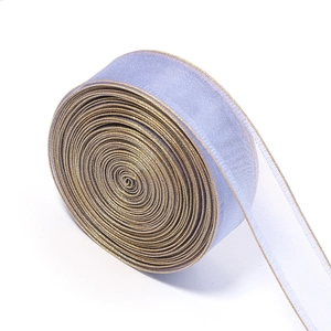 Close-up of lavender organza ribbon with gold edges for gift wrapping and DIY crafts