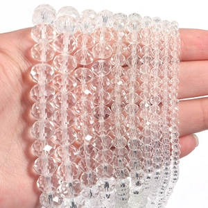 Macro view of transparent faceted crystal beads in various sizes for DIY jewelry