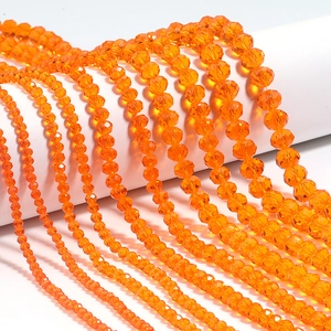 Detail of multi-size orange faceted crystal abacus beads for DIY jewelry making