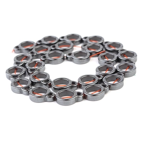 Macro view of dark grey metallic hematite bead spacers for DIY jewelry making