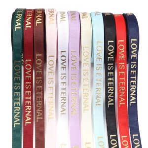 Colorful Christmas grosgrain ribbons with gold 'Love Is Eternal' printing in 11 shades