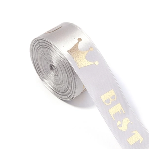 Detail of silver satin ribbon with gold crown and BEST print for gift wrapping