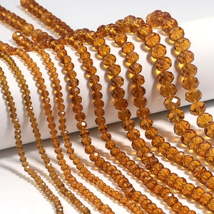 Macro detail of faceted amber glass beads for DIY jewelry with sparkling crystal texture