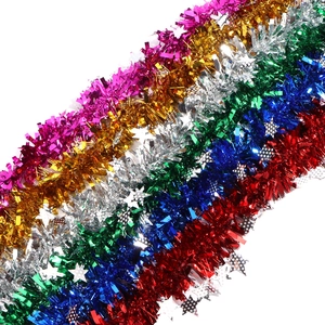 Sparkling Christmas tinsel garland with silver stars for festive holiday party home decor