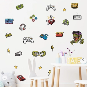 Detail of retro video game wall decals featuring controllers and VR headset in a playroom