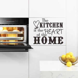 Detail of The Kitchen Is The Heart Of The Home black vinyl wall decal with heart design