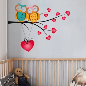 Cartoon owl couple on branch wall decal for kids room with red heart accents