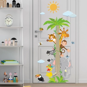 Detailed jungle animal wall stickers featuring giraffe and elephant on a white nursery door
