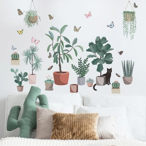 Close-up of artistic cat and green plant wall stickers for a modern bedroom interior decoration