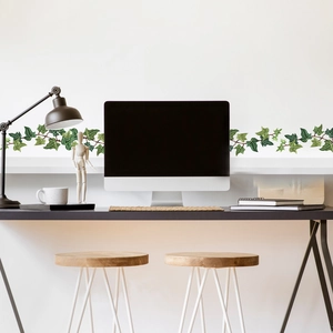 Detail of ivy leaf baseboard wall sticker applied in a modern home office setting