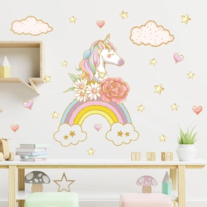 Close-up of unicorn wall decals with rainbows and stars in soft macaron colors