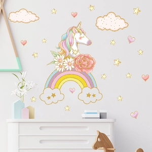 Unicorn and rainbow wall sticker set for kids room with pink clouds and golden stars