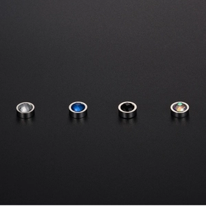 Unisex titanium steel magnetic stud earrings set with four colorful faceted crystals