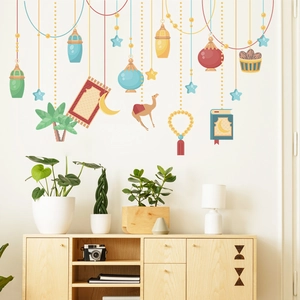 Detailed view of colorful Ramadan lanterns and crescent moon wall decals in a warm room setting