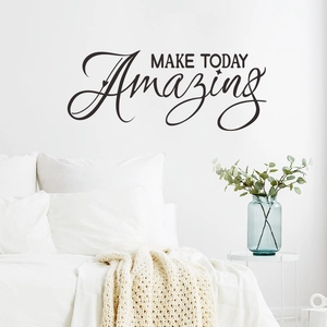 Close-up of black 'MAKE TODAY Amazing' wall sticker on a clean white bedroom wall