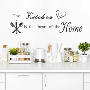 Kitchen wall decal featuring cutlery icons and heart of the home quote on white wall