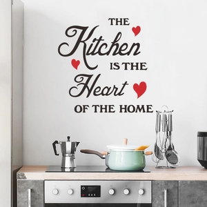 Detail of kitchen wall decal with heart decor and art text over a modern stove