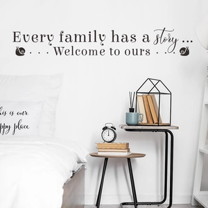 Close-up of Family Story wall decal above a modern bed in a cozy bedroom setting