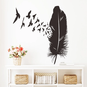 Detail of artistic black feather and birds wall sticker in a modern living room