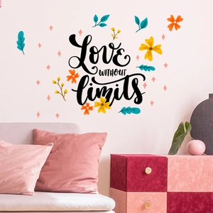 Detail of 'Love without limits' wall decal with colorful floral elements on white wall