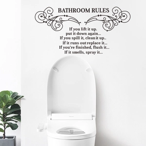 Detail view of black Bathroom Rules vinyl wall decal with elegant scroll patterns
