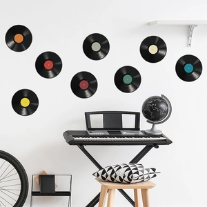 Detailed view of 8 vintage vinyl record wall stickers displayed in a music-themed room