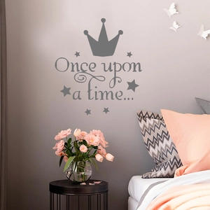 Detailed view of Once Upon a Time wall sticker with crown and stars over a bed