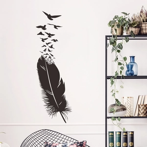 Artistic black feather turning into flying birds wall sticker on white wall interior