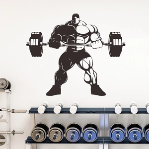 Wall decal detail showing muscular athlete silhouette lifting weights in gym setting