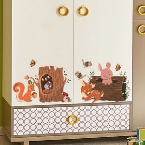 Detail of forest animal wall stickers with cute fox, deer, and squirrel on a white cabinet