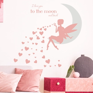Detail of pink fairy and moon wall sticker with heart elements in a cozy bedroom
