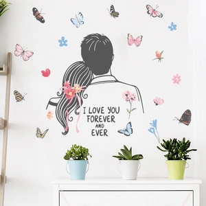 Romantic cartoon couple silhouettes with butterflies and flowers wall decal for home decor