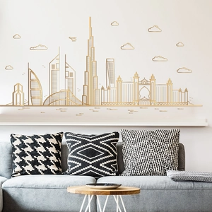 Detail of golden Dubai skyline wall stickers featuring Burj Khalifa on a modern living room wall