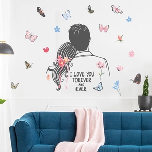 Detail showing romantic couple silhouettes and butterflies wall sticker in a living room