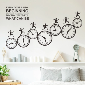 Macro detail of black vinyl wall stickers featuring motivational clocks and runners